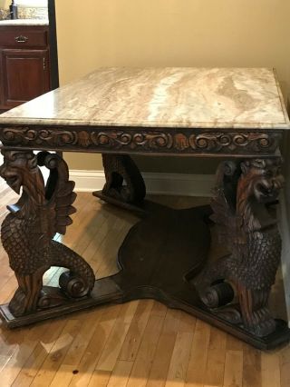 Table Marble top,  gargoyle carved legs (36 X 60 inches),  height 28 1/2 inch 2