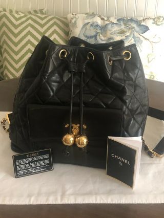 Chanel Vintage Black Lambskin Quilted Gold Ball Drawstring Backpack Purse Bag