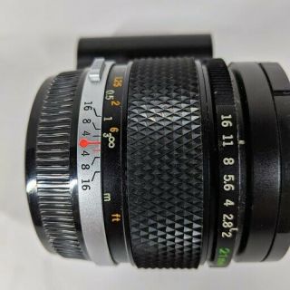 Olympus OM - SYSTEM E.  Zuiko MC Auto - W 21mm f2 lens with caps rare 3