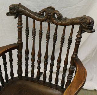 Antique Victorian Oak Rocking Chair – with spindles carved dolphin 2