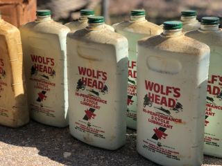 vintage Wolfs Head oil Bottles outboard marine motorcycle cans display 2stroke 4