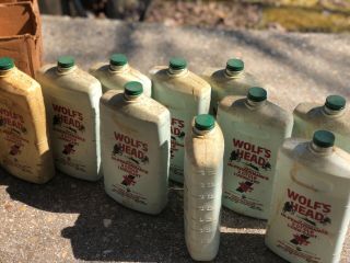 vintage Wolfs Head oil Bottles outboard marine motorcycle cans display 2stroke 8