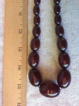 VINTAGE BAKELITE NECKLACE CHERRY AMBER RED OBLONG BEADS threaded on CHAIN 5