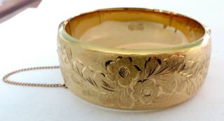 A Vintage 1950s 1/20th 12ct Rolled Gold Opening Bangle With A Flower Design