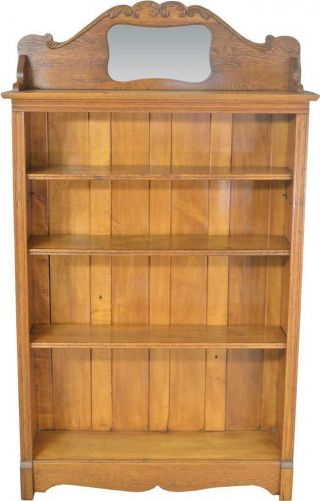 17663 Oak Larkin Bookcase With Mirrored Carved Backsplash