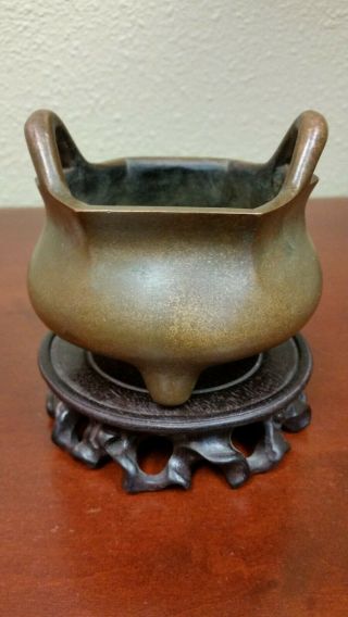 A Chinese Octagonal Bronze Censer With Ornate Wood Stand