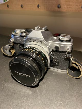 Canon Ae - 1 35mm Slr Film Camera Kit With Fd 50 Mm Lens.  Comes With Vintage Strap