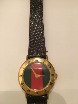 Vintage GUCCI Watch 3000.  2.  L - With Gucci leather band.  0356037 2