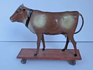 Antique Toy Paper Mache Cow On Wood Platform With Wheels C.  1900