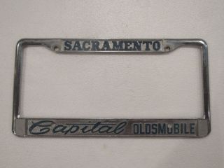 Vintage Sacramento Capital Oldsmobile Dealership License Plate Frame Metal Rare