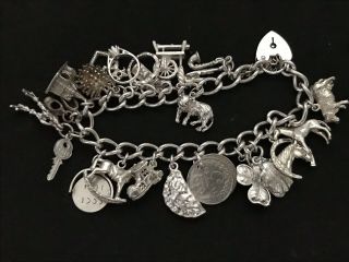 Vintage Sterling Silver Charm Bracelet with 21 Silver Charms.  61 grams 4