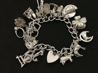 Vintage Sterling Silver Charm Bracelet with 21 Silver Charms.  61 grams 5
