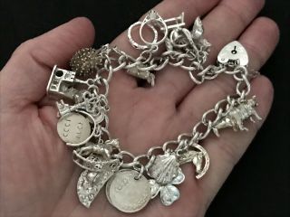 Vintage Sterling Silver Charm Bracelet with 21 Silver Charms.  61 grams 7