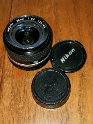 Vintage Nikon Nikkor 24mm F:1:2.  8 With Lens Caps No.  730068