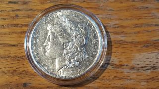 1894 O Morgan Silver Dollar.  Full Breast Feathers.  A Rare Morgan Dollar.