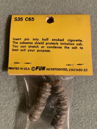 5 VINTAGE FUN INC.  RACK ITEMS - Cigarette Ashes,  Wooden Nickle,  Auto Whistle, 5