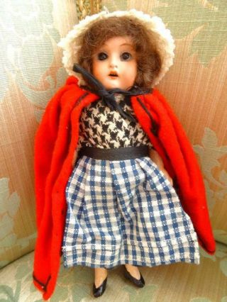 An Immaculate Antique German Bisque Little Red Riding Hood Doll C.  1915