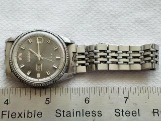 A Vintage Stainless Steel Orient Wrist Watch With Band.