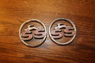 Two Vintage Round Chevrolet Impala Ss Trim Number 3827300 Possibly 1963 Or 1964