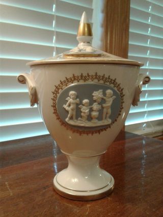 Vintage Porcelain Urn With Lid And With Applied Bisque Cherub Figures