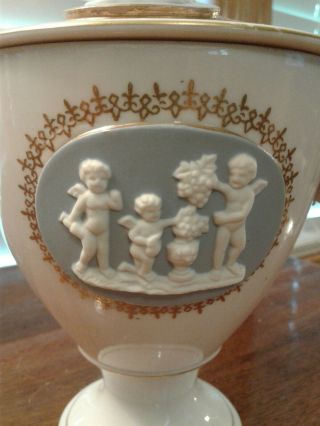 Vintage Porcelain Urn With Lid And With Applied Bisque Cherub Figures 2