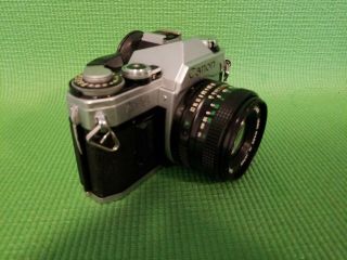 Canon AE - 1 35mm Camera (1) with Two FD 50mm 1:1.  8 Lenses 2