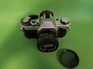 Canon AE - 1 35mm Camera (1) with Two FD 50mm 1:1.  8 Lenses 3