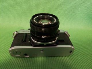 Canon AE - 1 35mm Camera (1) with Two FD 50mm 1:1.  8 Lenses 5