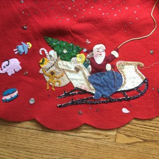 Vintage Christmas tree skirt,  Very Old 50” across.  Sequins,  felt.  Santa sleigh 2