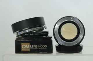 Olympus Zuiko Auto - S 55mm F1.  2 Lens with Cap & Hood 7