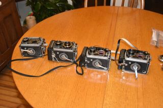 ROLLEIFLEX PARTS FROM FOUR CAMERAS,  INCLUDING SOME SHUTTERS,  LENSES ETC NR FS 5