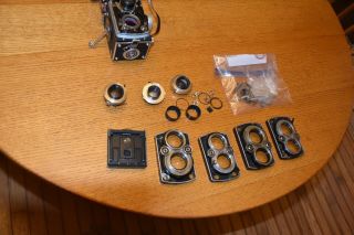 ROLLEIFLEX PARTS FROM FOUR CAMERAS,  INCLUDING SOME SHUTTERS,  LENSES ETC NR FS 6