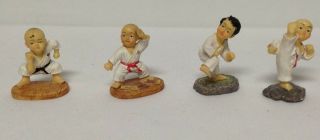 Set Of 4 Vintage Resin Karate Boy Man Figurines Bald Head 1 Girl Woman
