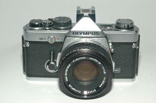 Olympus OM - 2 film camera with Olympus F.  Zuiko 50mm 1.  8 lens, 2