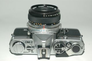 Olympus OM - 2 film camera with Olympus F.  Zuiko 50mm 1.  8 lens, 4