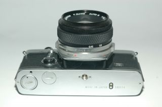 Olympus OM - 2 film camera with Olympus F.  Zuiko 50mm 1.  8 lens, 5