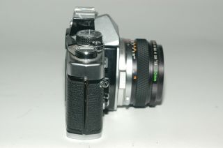 Olympus OM - 2 film camera with Olympus F.  Zuiko 50mm 1.  8 lens, 7