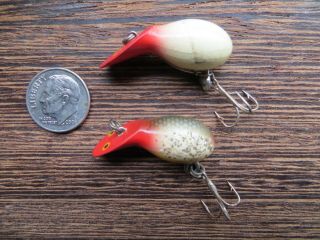 Two Heddon Widgets Both But The Red Head Silver Scale Is