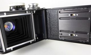 Rollei Rolleiflex f2.  8 E Xenotar w/case mirror lens cap,  scissors strap,  STicky 10