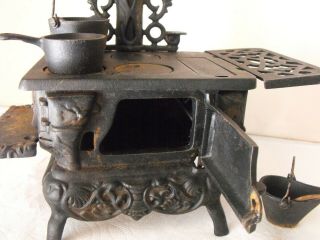 Vintage Crescent Cast Iron Mini Toy Stove With Accessories Smaller Version 3