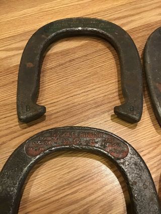 VINTAGE SET OF (4) DIAMOND DULUTH DOUBLE RINGER HORSESHOES 2 - 1/2 LBS Official 2