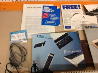 Atari 800XL computer,  AND,  power adapter,  TV Cables 5
