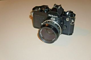 Black Nikon Fm 35mm Slr Camera W/nikkor 50mm F2 Lens