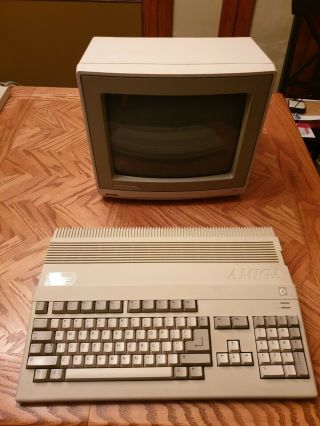 Commodore Amiga 500 with monitor and power supply along with a printer 12