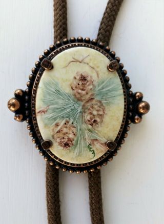VINTAGE BOLO TIE,  HAND PAINTED PORCELAIN,  AND COPPER COLOR,  SIGNED,  PINE CONES 2