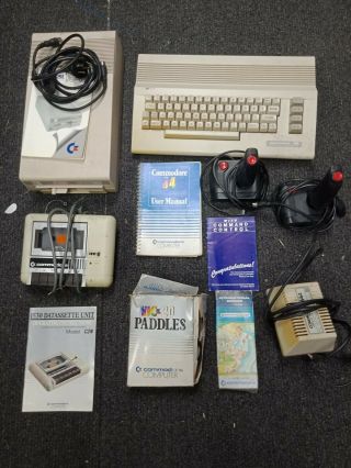 Commodore 64 Computer With Accessories.  Datasette,  Books,  Floppy Etc.