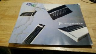 Atari 800XL computer,  AND,  power adapter,  TV Cables 4