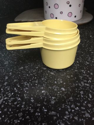 Vintage Tupperware Yellow Nesting Measuring Cups Set Of 4,  3/4,  2/3,  1/3,  1/4