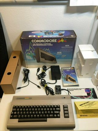 Commodore 64 - Power Supply,  Manuals,  Cables 8 - 9/10 - Serial: P01387820