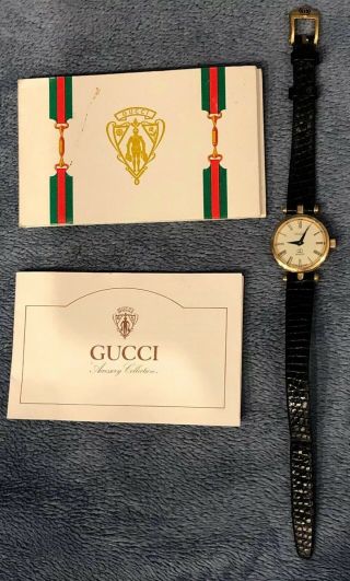 Vintage Gucci Woman’s Wrist Watch Gold Tone Black Leather Swiss Made